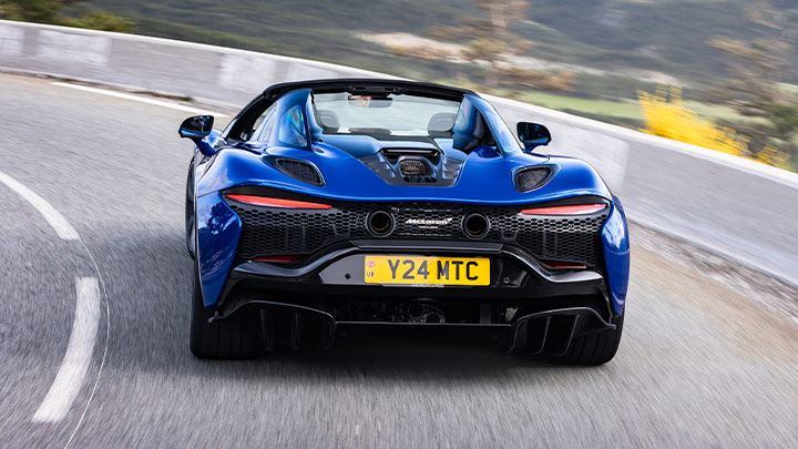 Blue McLaren Artura Spider Coasting Around Corner