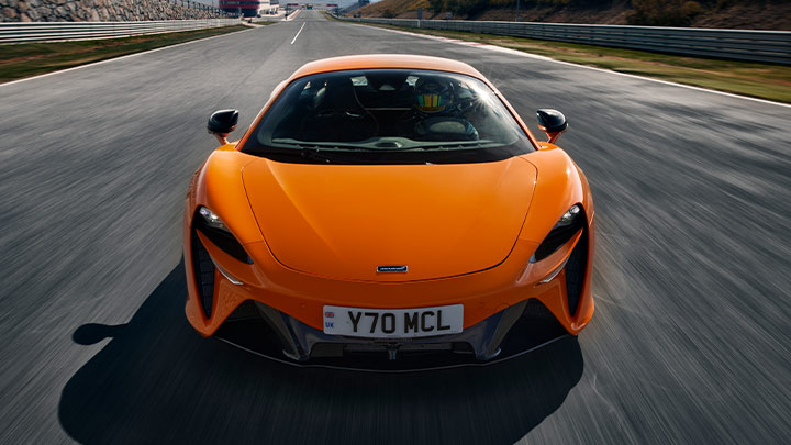 Orange McLaren Artura Driving On Track