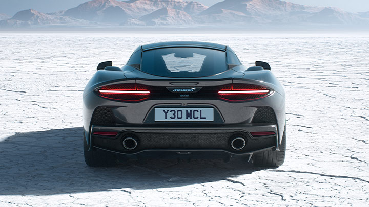 Rear Shot Of Grey McLaren GTS On Cracked Snowy Ground