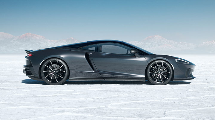 Side Shot Of Grey McLaren GTS On Cracked Snowy Ground