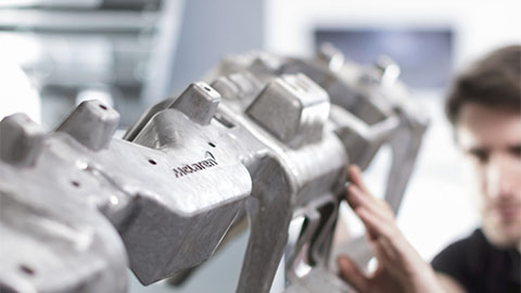 Technician Servicing a McLaren Engine