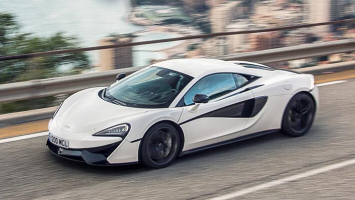 Side Shot Of White McLaren 540C Driving