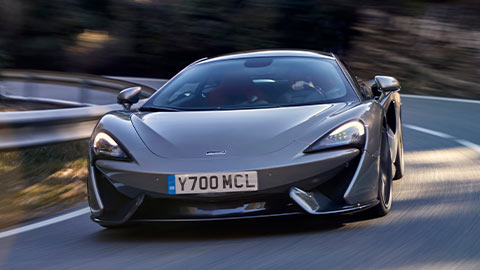 Grey McLaren 570GT Driving