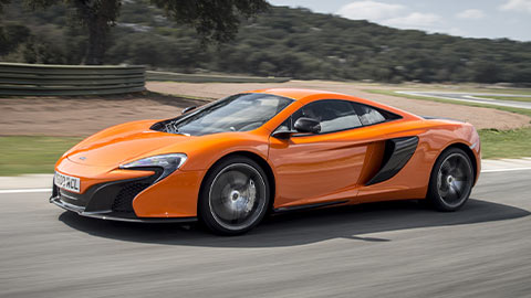 Orange McLaren 650S Driving On Road