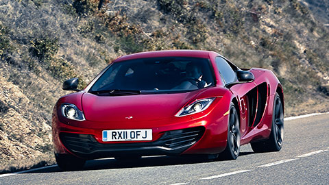 Red McLaren MP4-12C Driving On Road