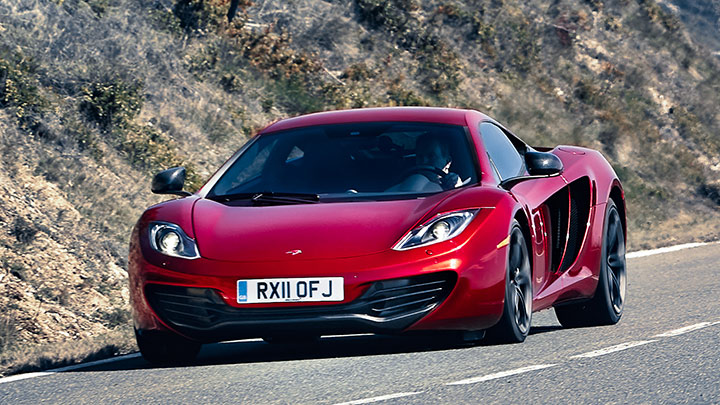 Red McLaren MP4-12C Driving On Road