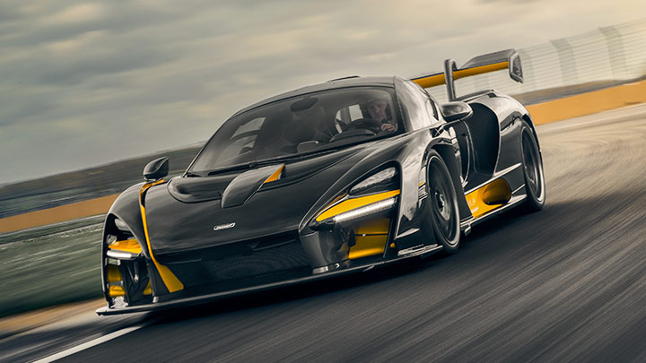 Black and Orange McLaren Senna Driving On Track