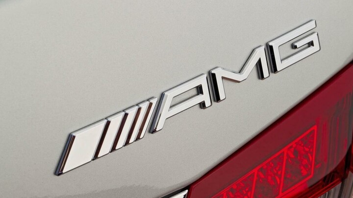 Close up of Mercedes-Benz AMG badge on a silver car.