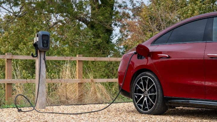 Mercedes Benz Charging red car plugged in