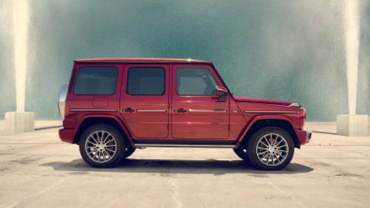 Side view of a red Mercedes-Benz G-Class.