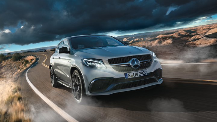 Silver Mercedes-Benz GLE-Coupe driving on the road.