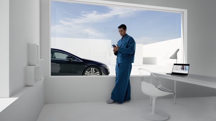 Man in front of Mercedes-Benz Model using Mercedes-Benz App