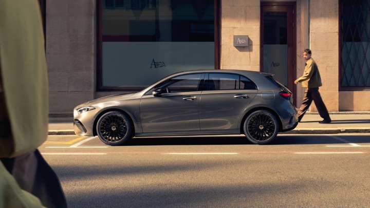 Grey Mercedes-Benz A-Class Exterior Side with Person Walking By
