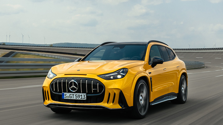 Yellow Mercedes AMG GT SUV front driving