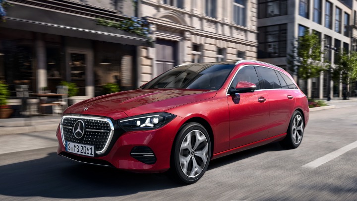 Red Mercedes-Benz C-Class estate driving