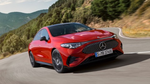 Red Mercedes Benz CLA Electric driving front  