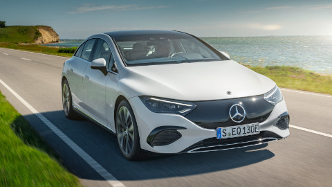 White EQE by Mercedes EQ Exterior Front Driving