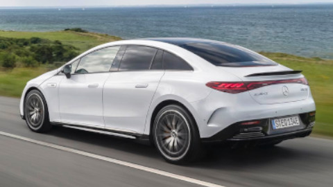 White EQE by Mercedes EQ Driving Rear