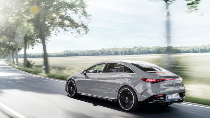 Grey Mercedes-Benz EQE Driving Rear
