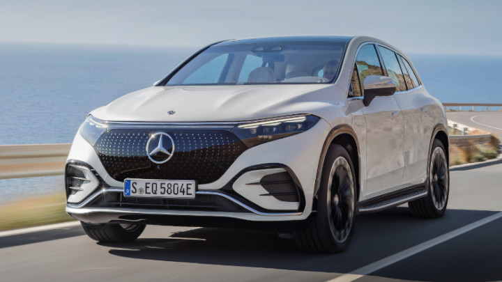 White EQS SUV from Mercedes-EQ Exterior Front Driving