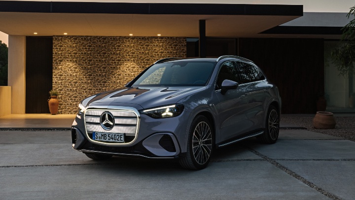 Grey Mercedes Benz GLC front end modern house