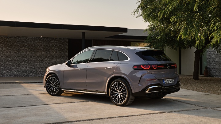 Grey Mercedes Benz GLC rear end outside modern house