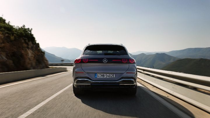 Grey Mercedes Benz GLC Rear end driving along mountain road