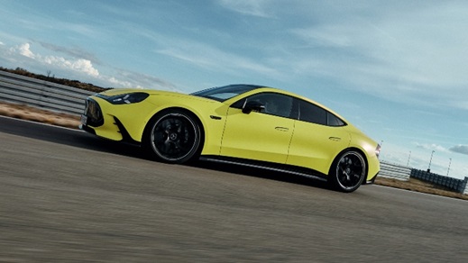 Green Mercedes-AMG GT 4 door coupe driving side