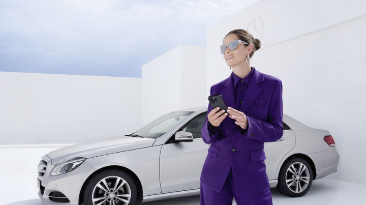 Woman Stood In Front Of Silver Mercedes-Benz Vehicle