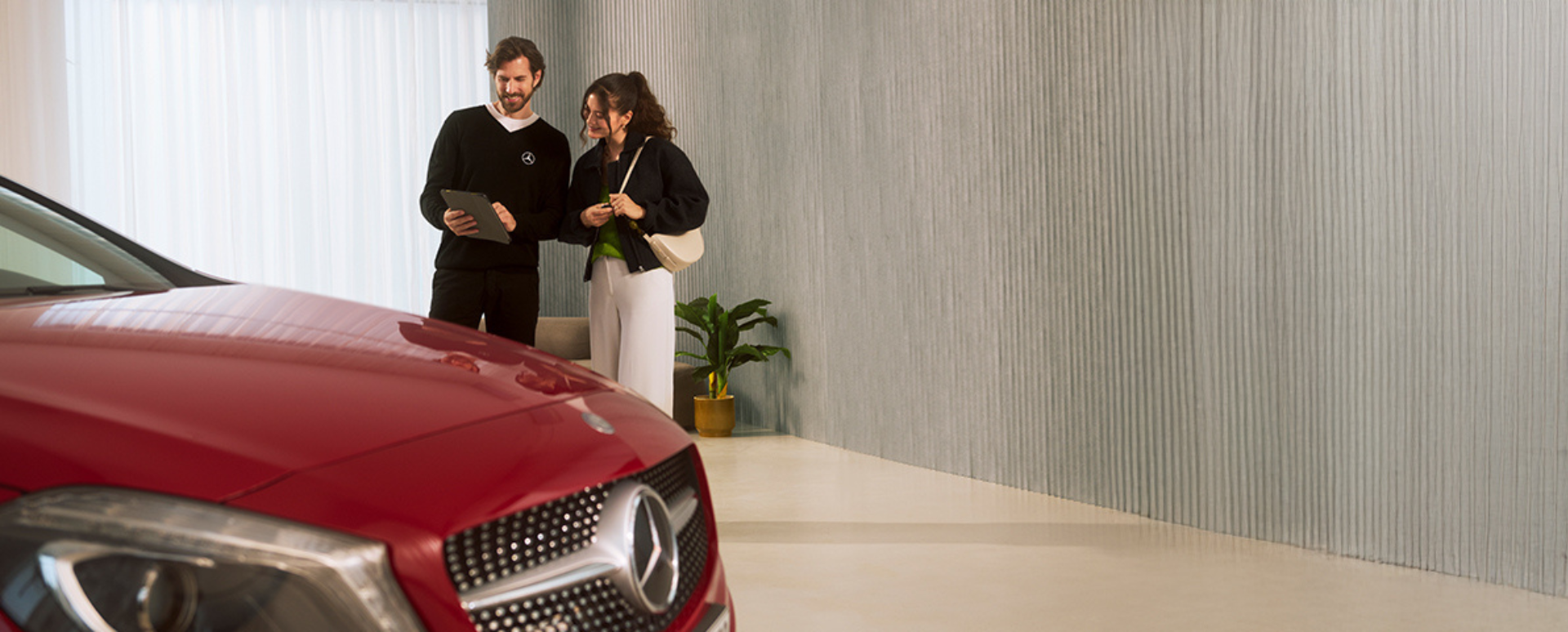 Two People Chatting With Red Mercedes-Benz In Foreground