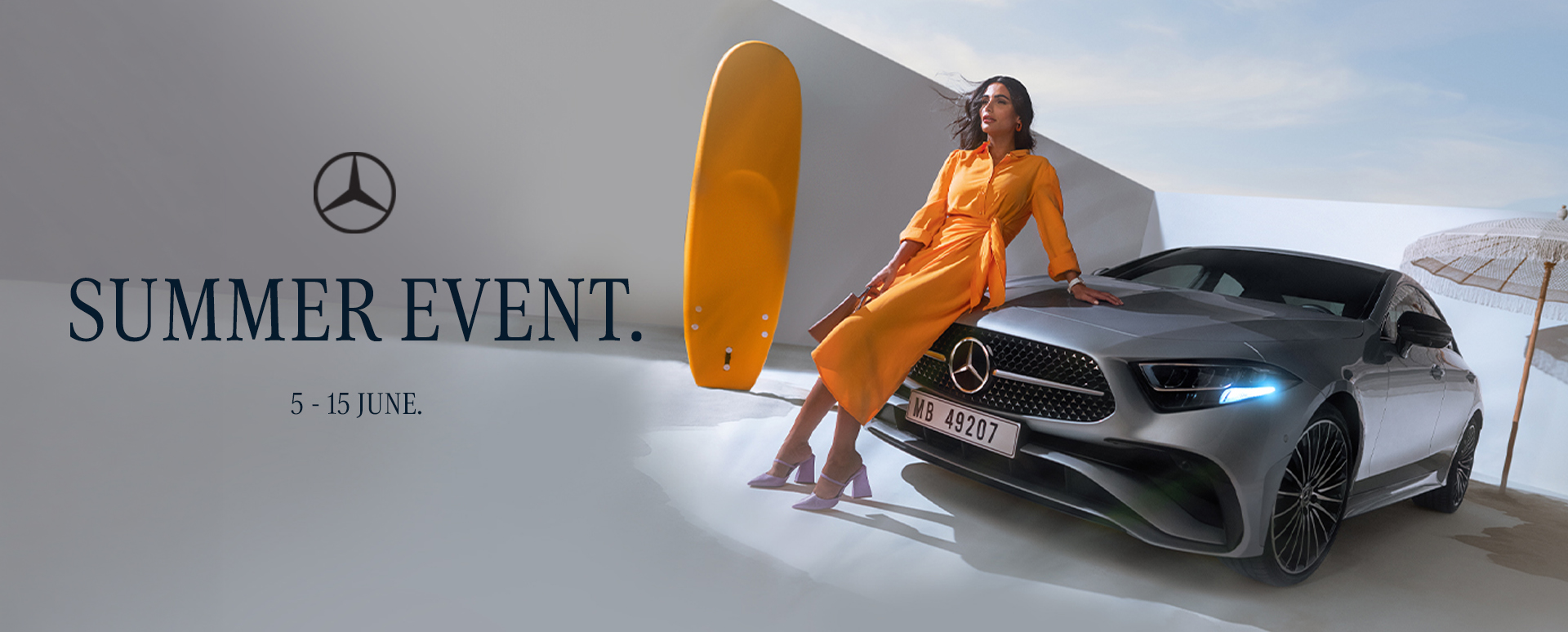 Women Leaning On Bonnet of Silver Mercedes-Benz
