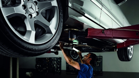 Technician Servicing Mercedes-Benz Car