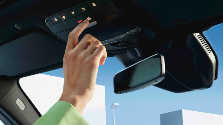 Hand Touching Call Button on Mercedes Me