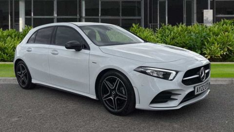 White Mercedes-Benz A-Class AMG Line Premium Edition parked in front of a dealership