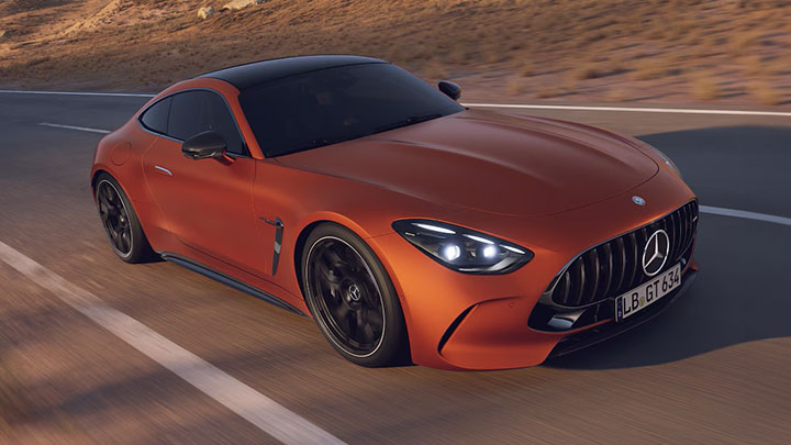 Orange Mercedes-Benz AMG-GT driving on the road
