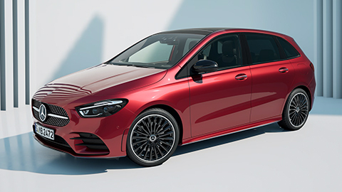 Red Mercedes-Benz B-Class parked in front of a white wall