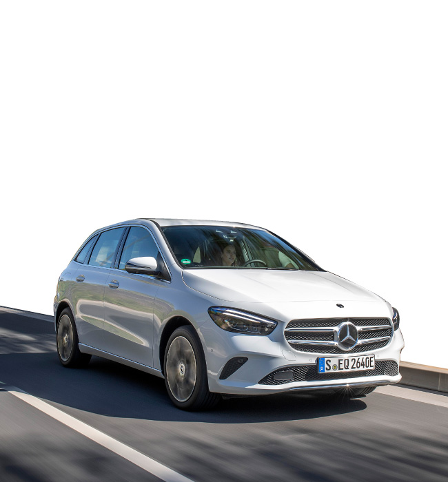 White Mercedes-Benz B-Class driving on the road