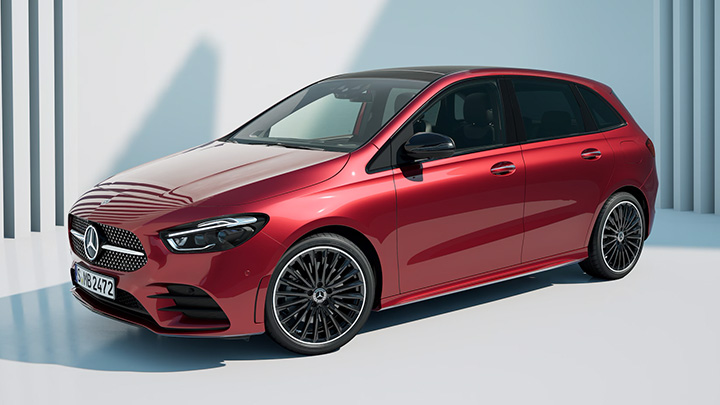 Red Mercedes-Benz B-Class parked in front of a white wall