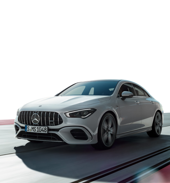 White Mercedes-Benz CLA driving on the road