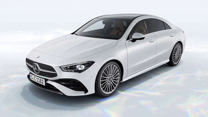 White Mercedes-Benz CLA parked in front of a white background