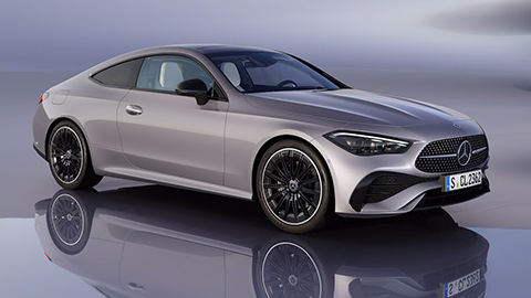 Silver Mercedes-Benz CLE parked in front of a grey background
