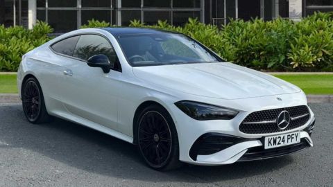 White Mercedes-Benz CLE AMG Line Premium parked in front of a dealership