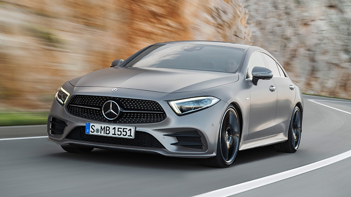 Grey Mercedes-Benz CLS driving on the mountain
