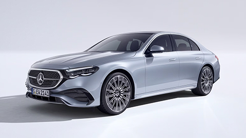 Silver Mercedes-Benz E-Class parked in front of a white background
