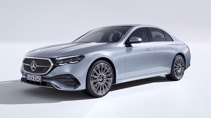 Silver Mercedes-Benz E-Class parked in front of a white background
