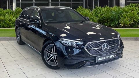 Black Mercedes-Benz parked in front of a dealership