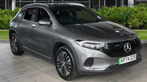 Grey Mercedes-Benz EQA parked in front of a dealership