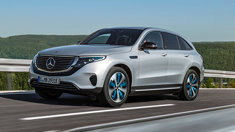 Silver Mercedes-Benz EQC driving on the road