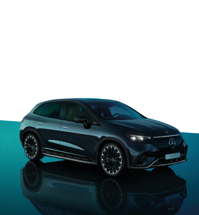 Black Mercedes-Benz EQE driving on a green background