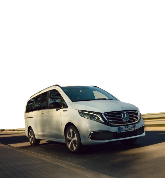 White Mercedes-Benz EQV driving on the road